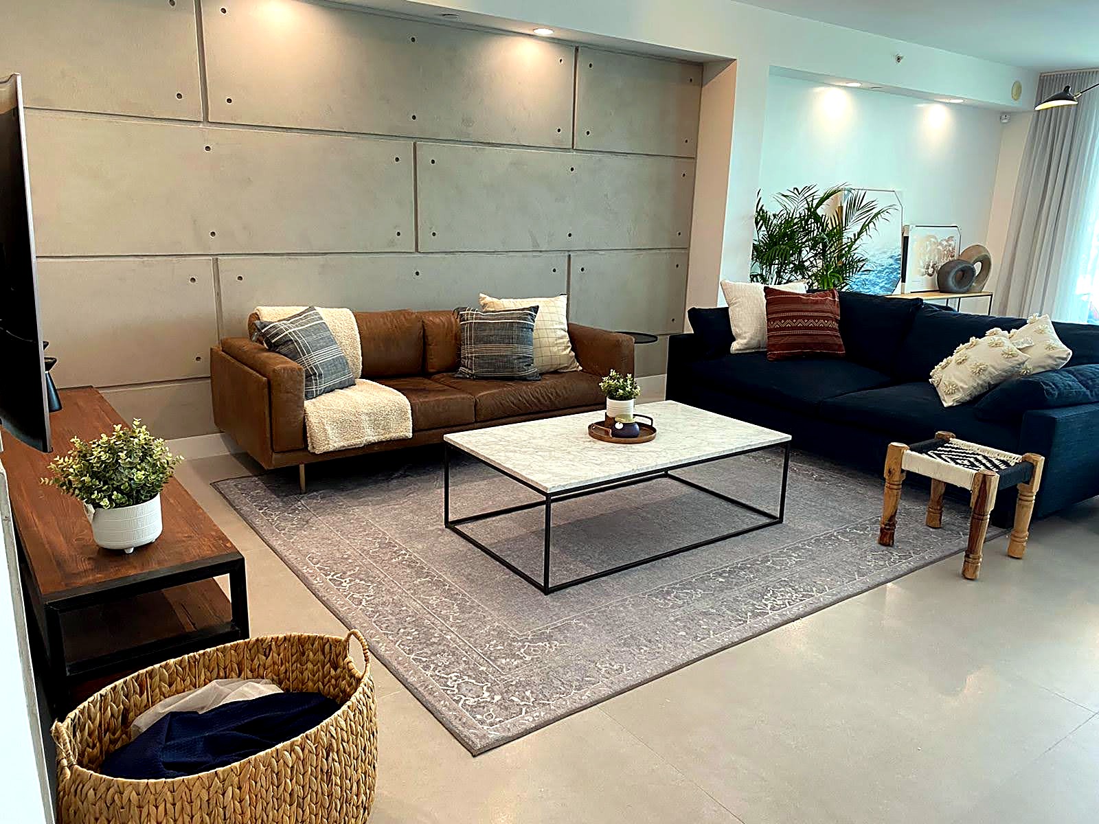Completed living room with a seamless microcement feature wall