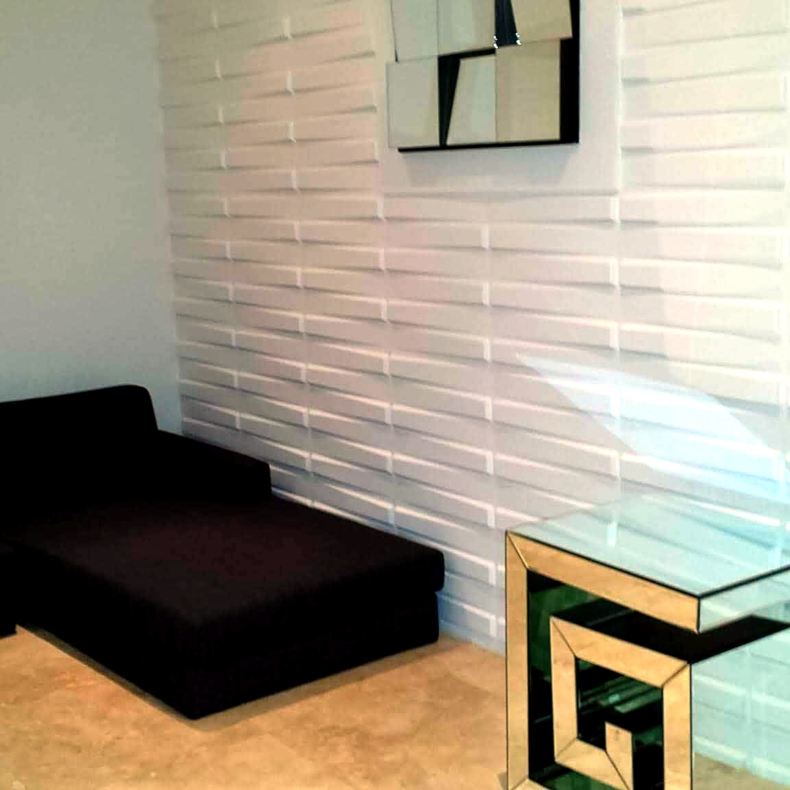 Lounge corner with white dimensional 3D wall panels