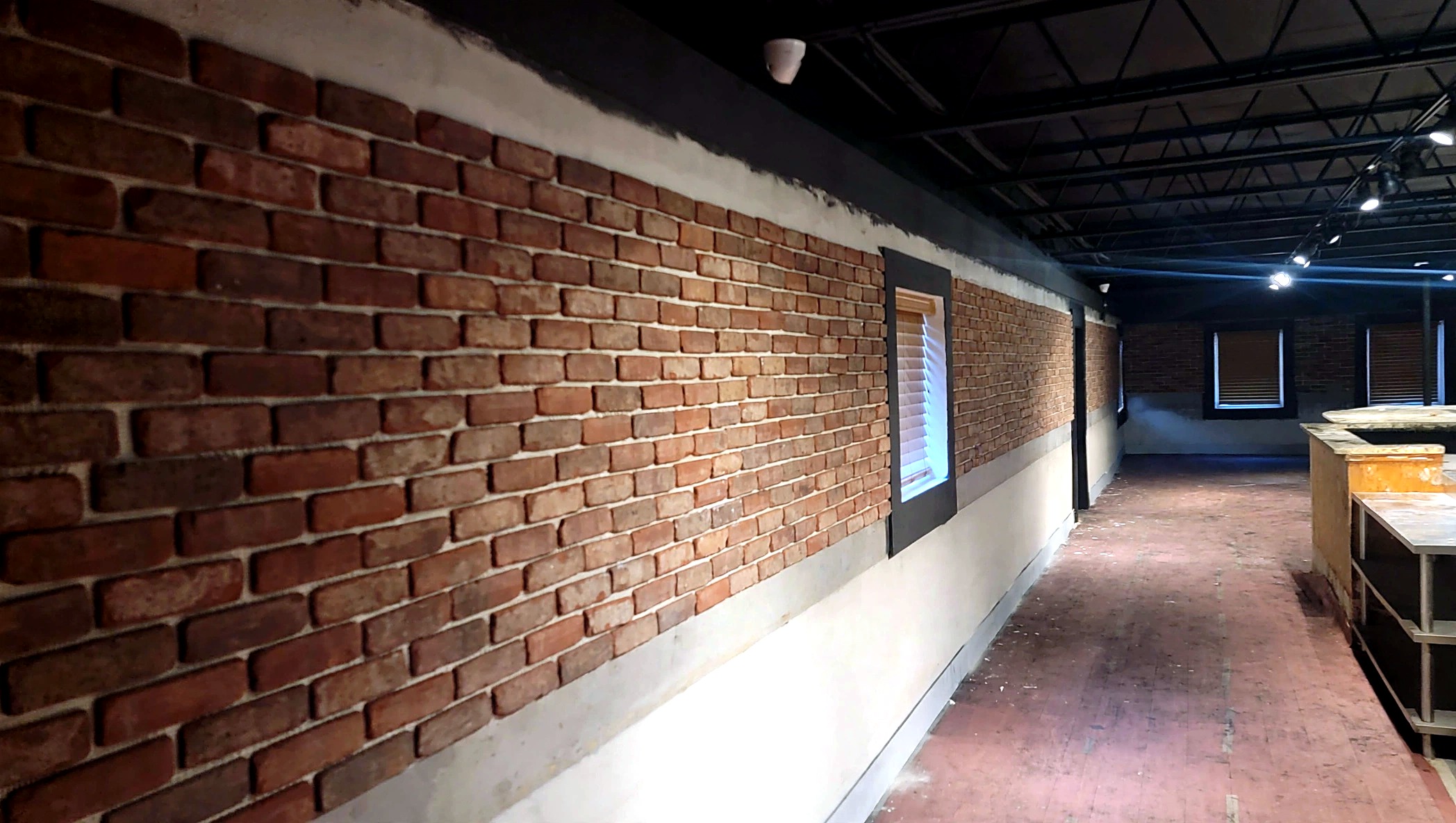 Brick wall panel installation in progress