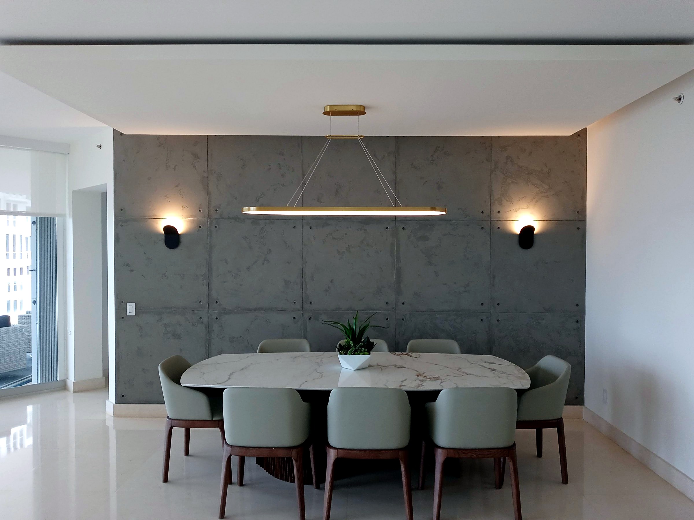 Dining room with a block-pattern microcement feature wall