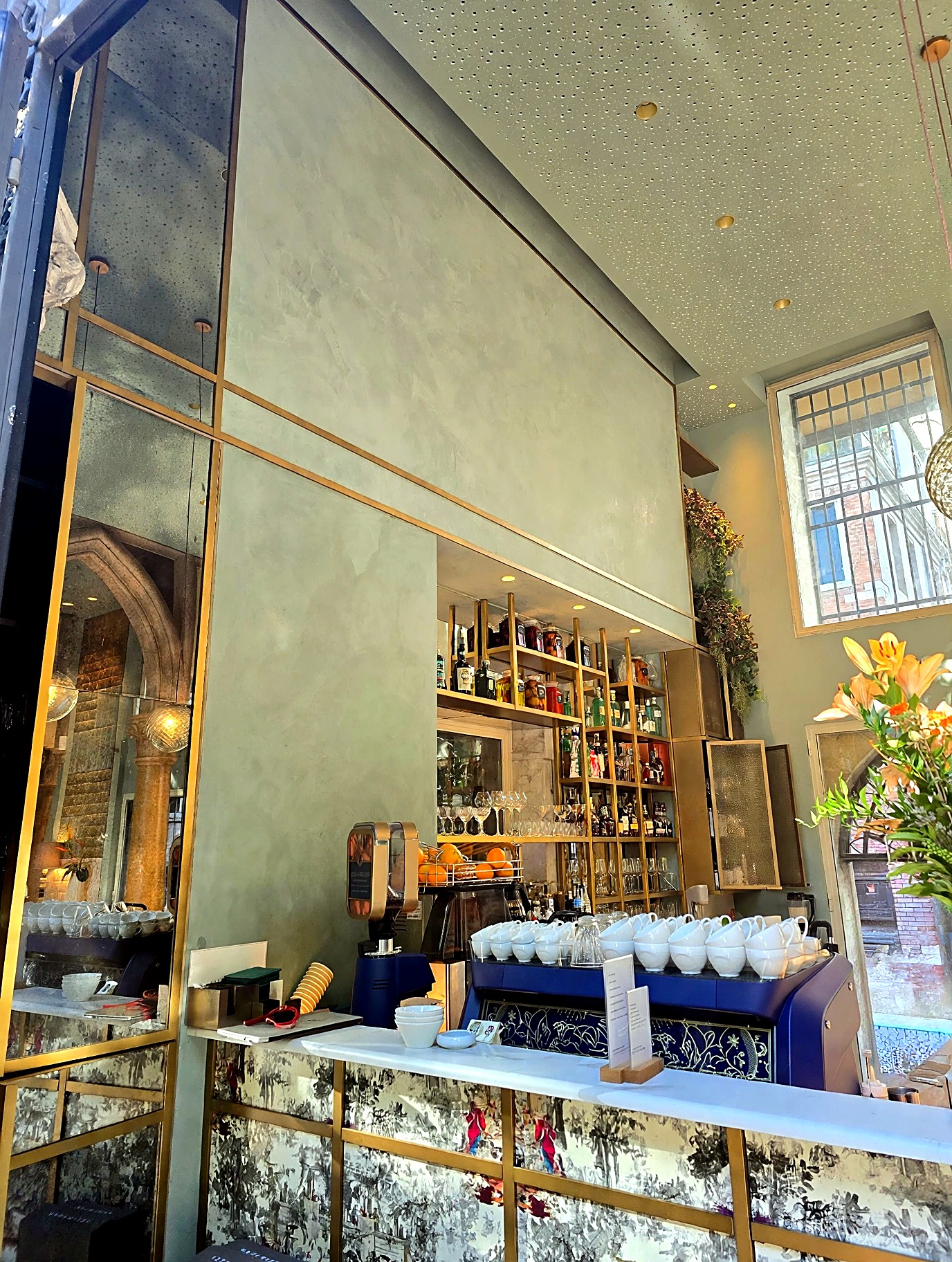 Italian café bar with warm Roman Clay surfaces