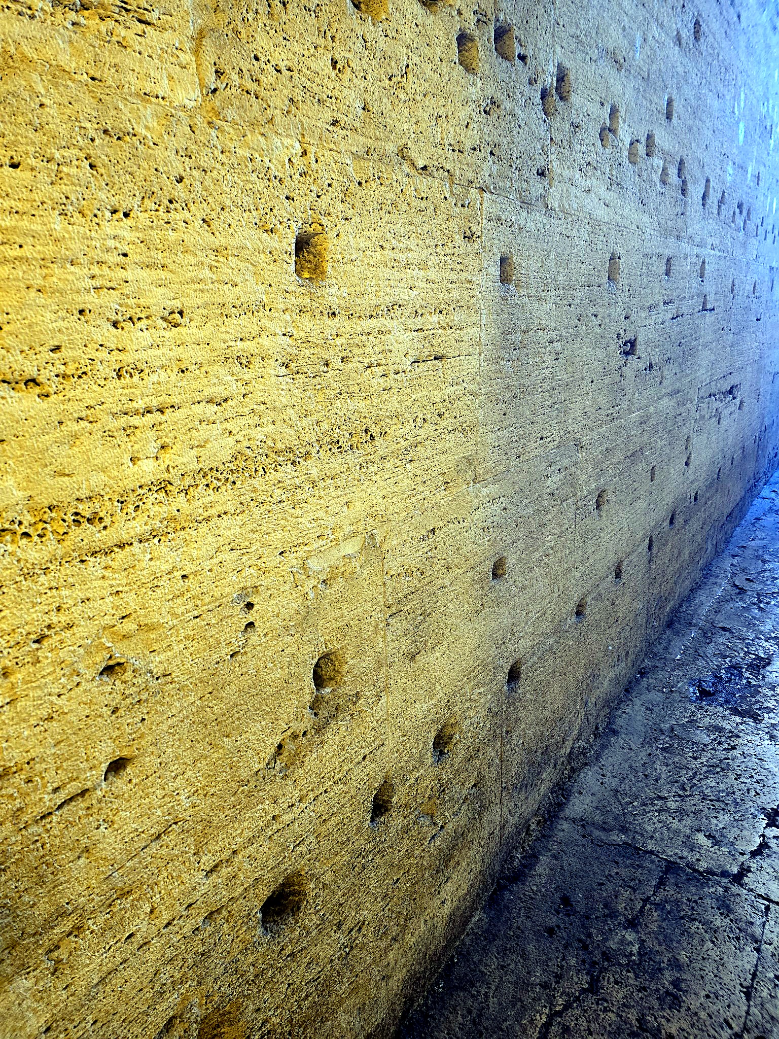Second detail view of the handcrafted golden travertine texture