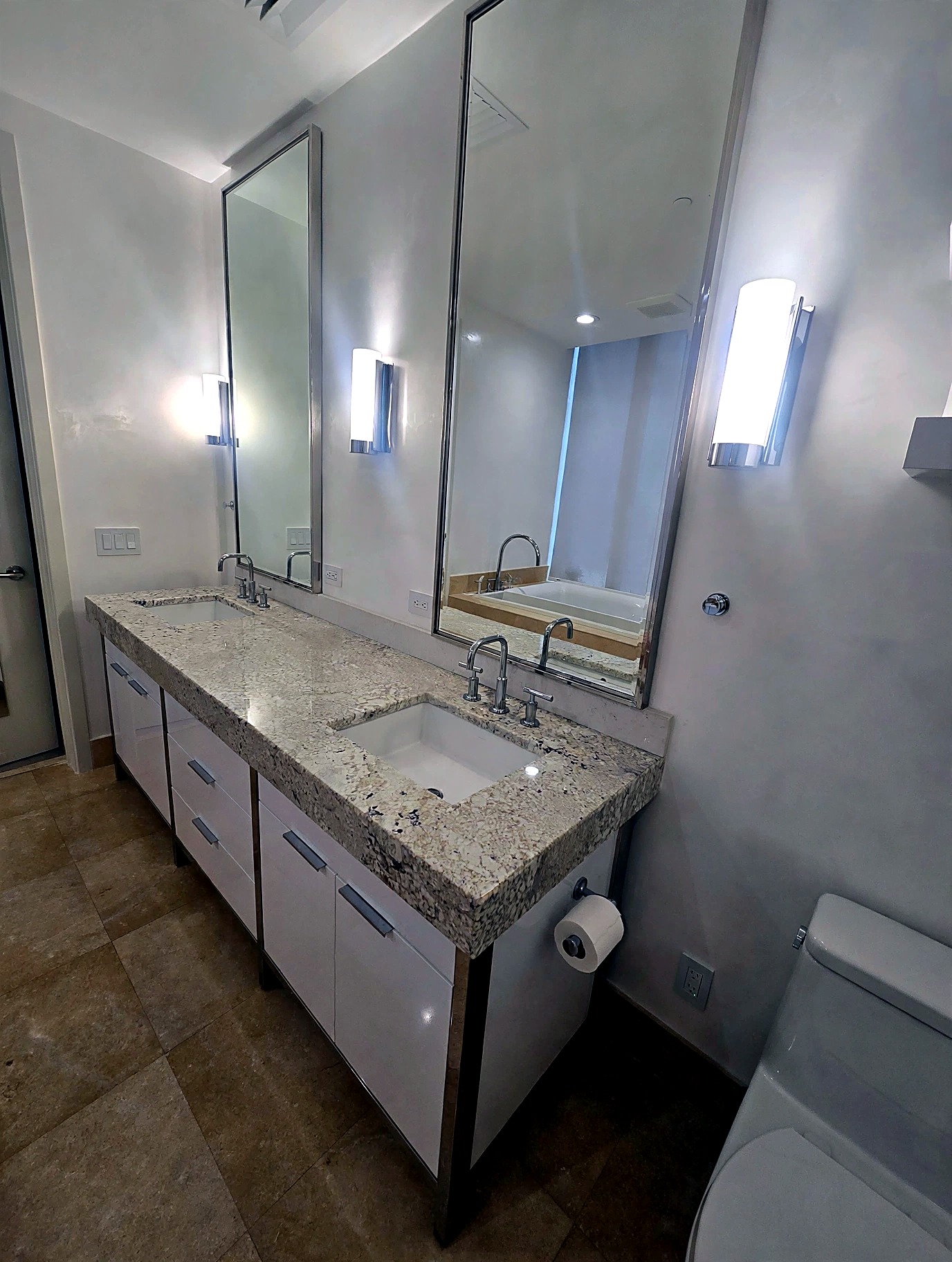 Double vanity bathroom with Venetian plaster walls