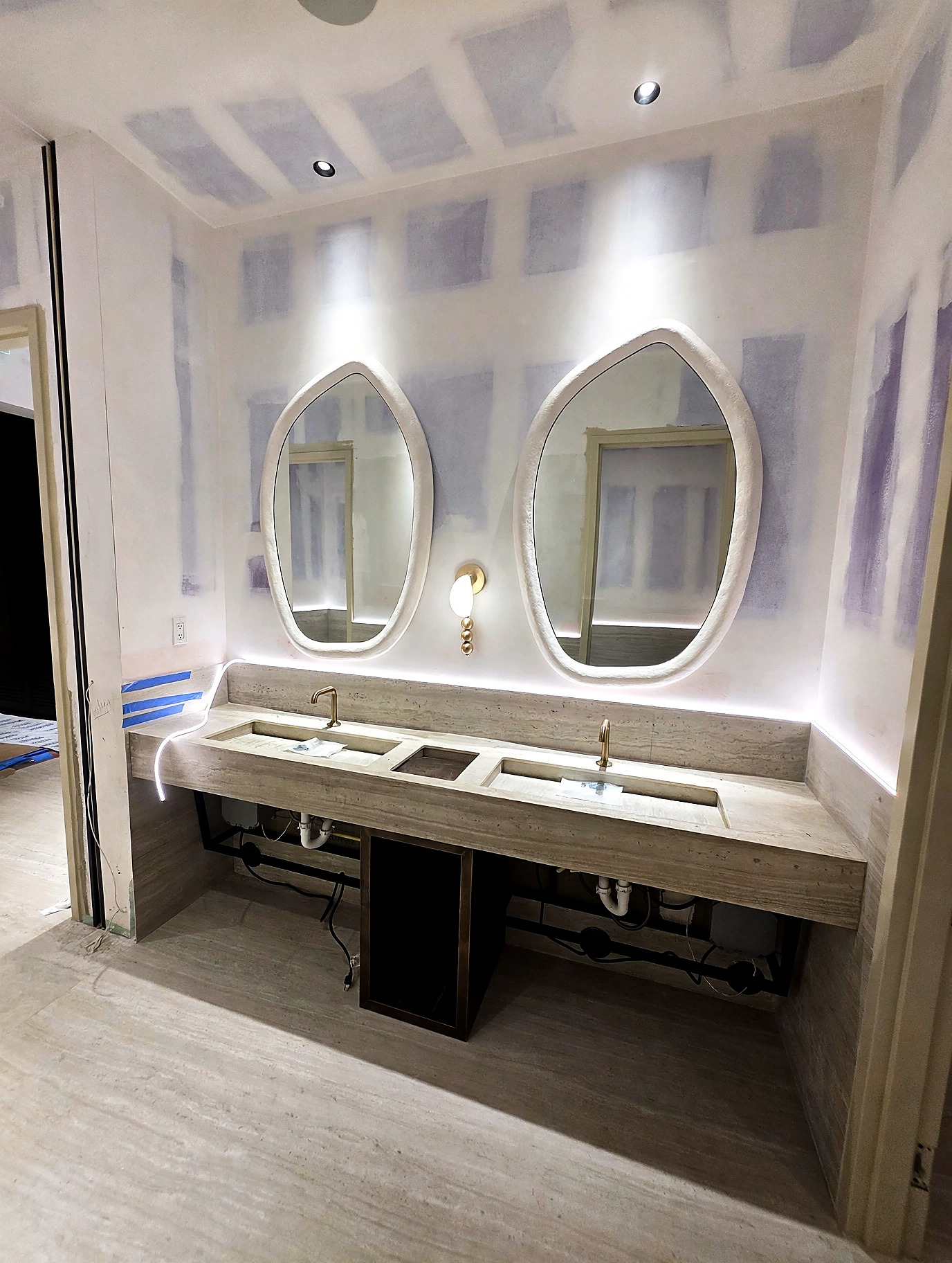 Bathroom vanity during construction before wall finishing
